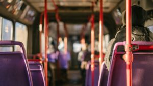 An view of a nearly empty bus aisle