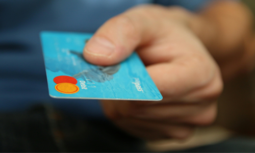 Close up shot of a hand holding a credit cart